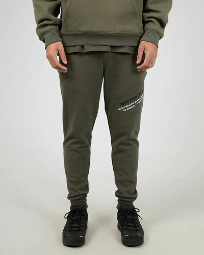 Male wearing a green hoodie and matching St Goliath logo Khaki jogger pants on a white background 