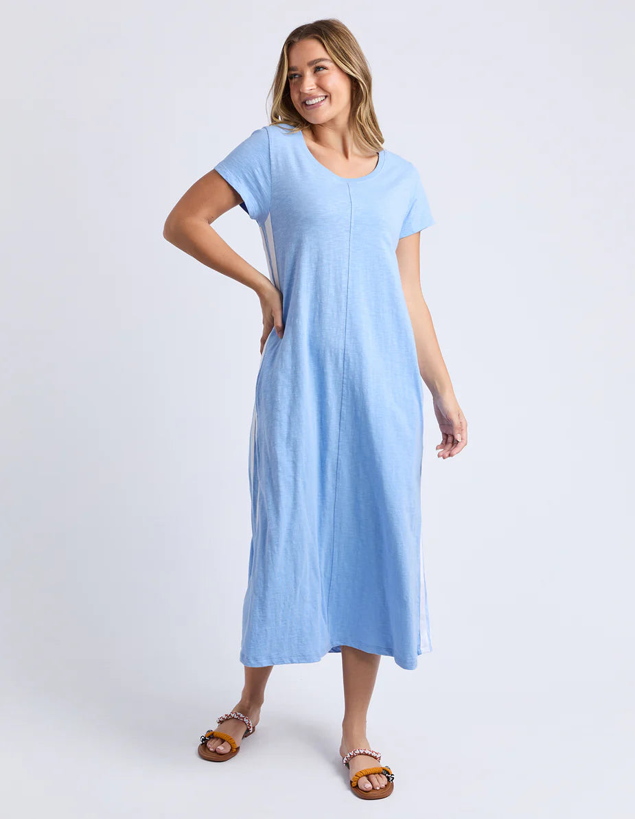 Woman wearing a Foxwood Recovery light blue dress on a white background