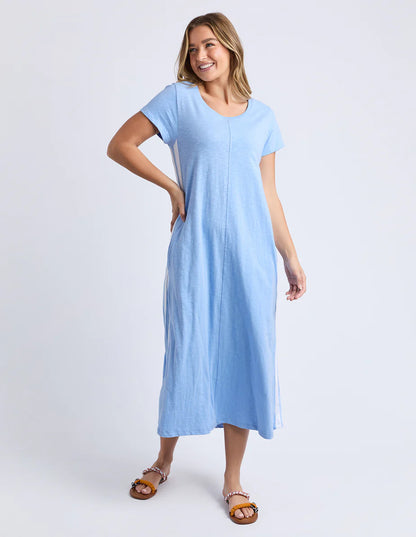 Woman wearing a Foxwood Recovery light blue dress on a white background