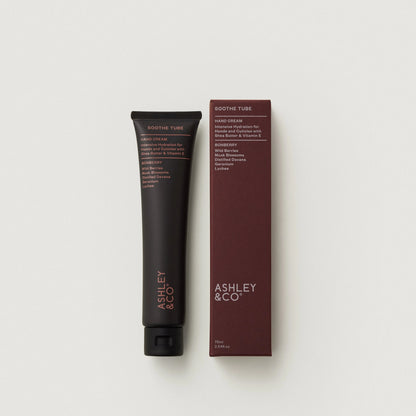 Soothe Tube Hand Cream tube and packaging with 'Ashley & Co' branding on a light gray background