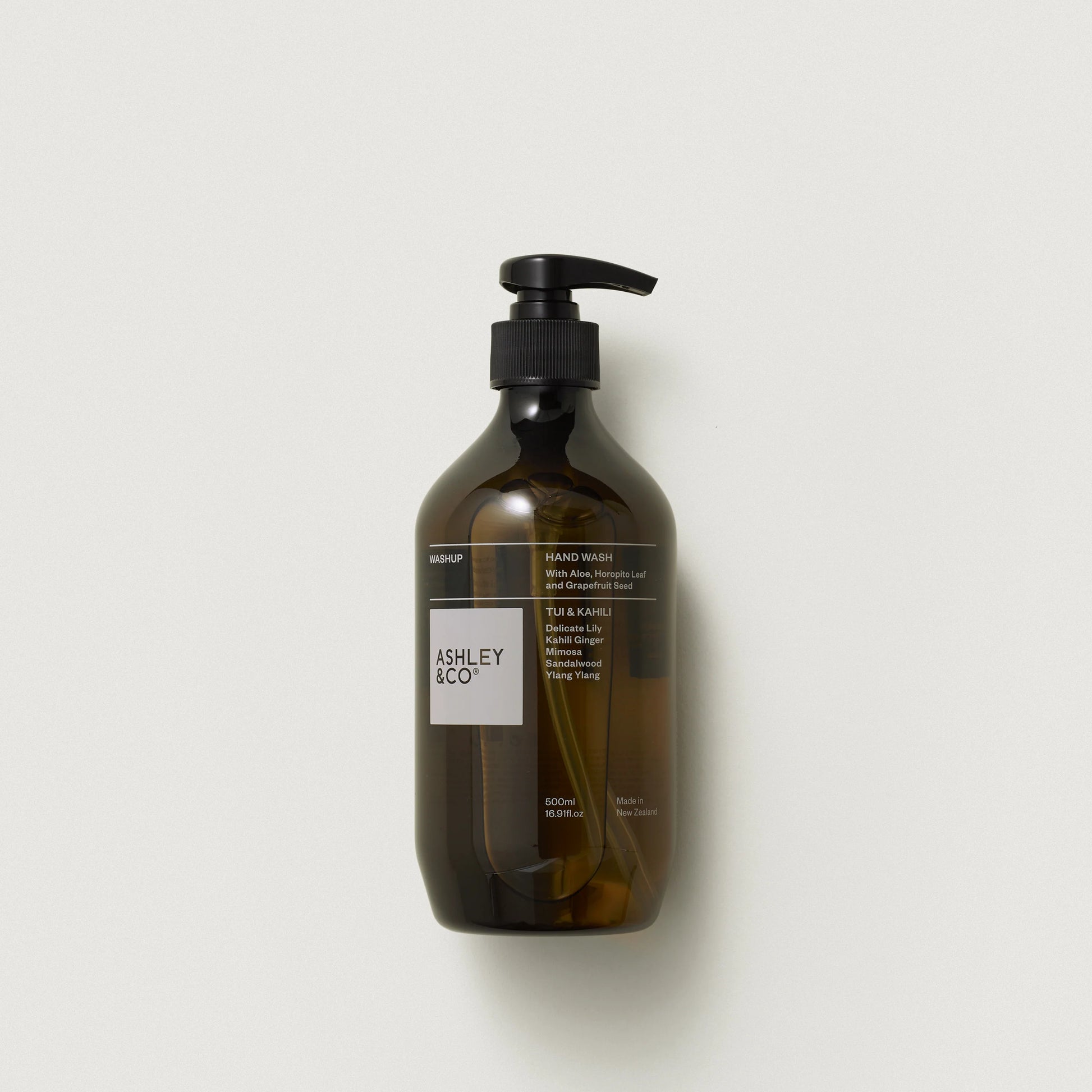 Brown bottle with pump and 'Ashley & Co' label on a light gray background