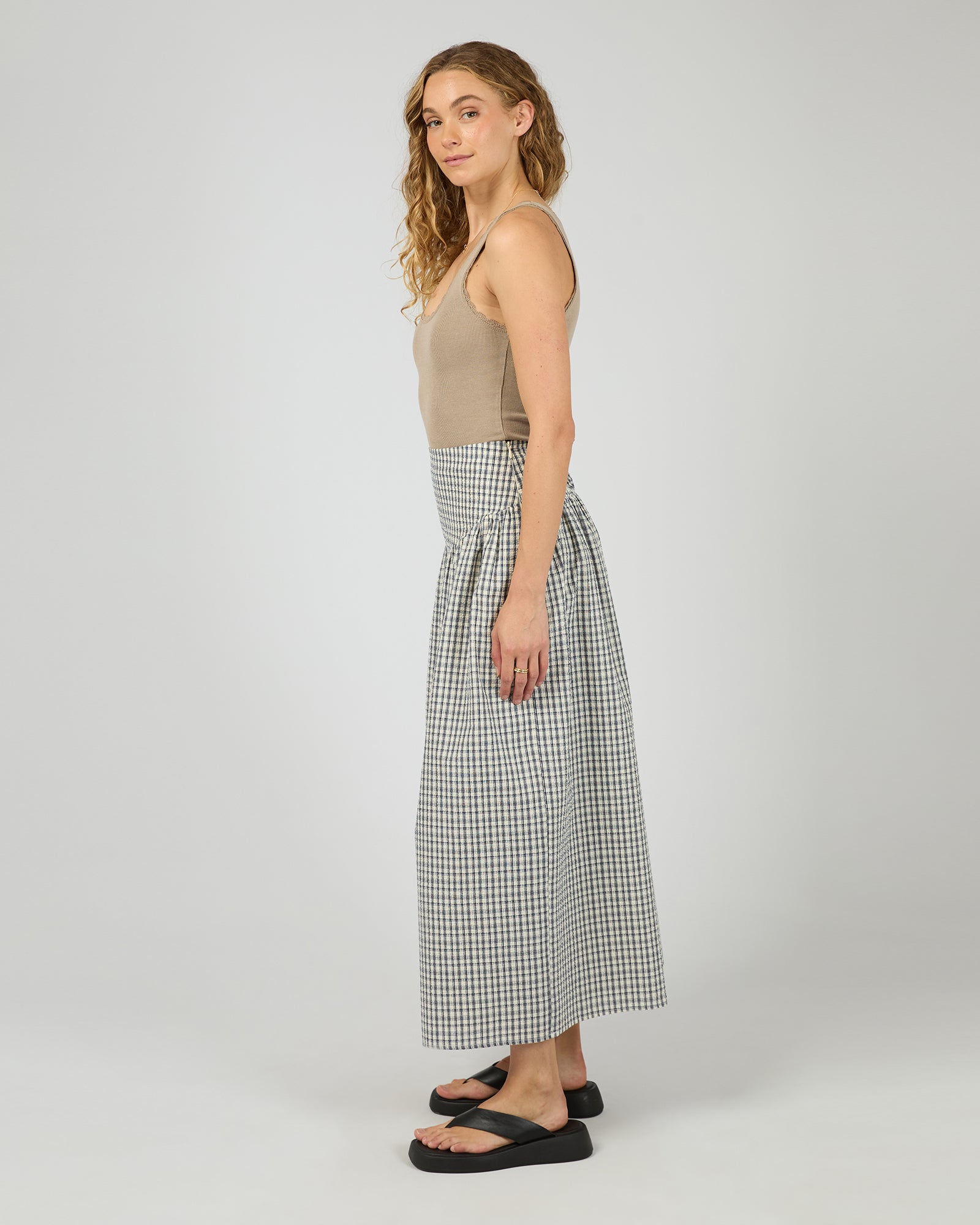Side angle of Checkered Twiggy Maxi Skirt by All About Eve