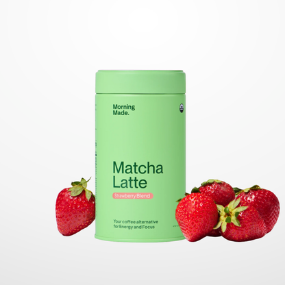 Green container labeled 'Matcha Latte' with strawberries on a white background