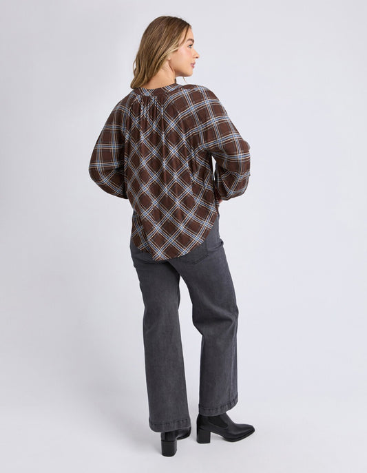 Back view of the Edison Check Top highlighting relaxed silhouette and yardage print.

