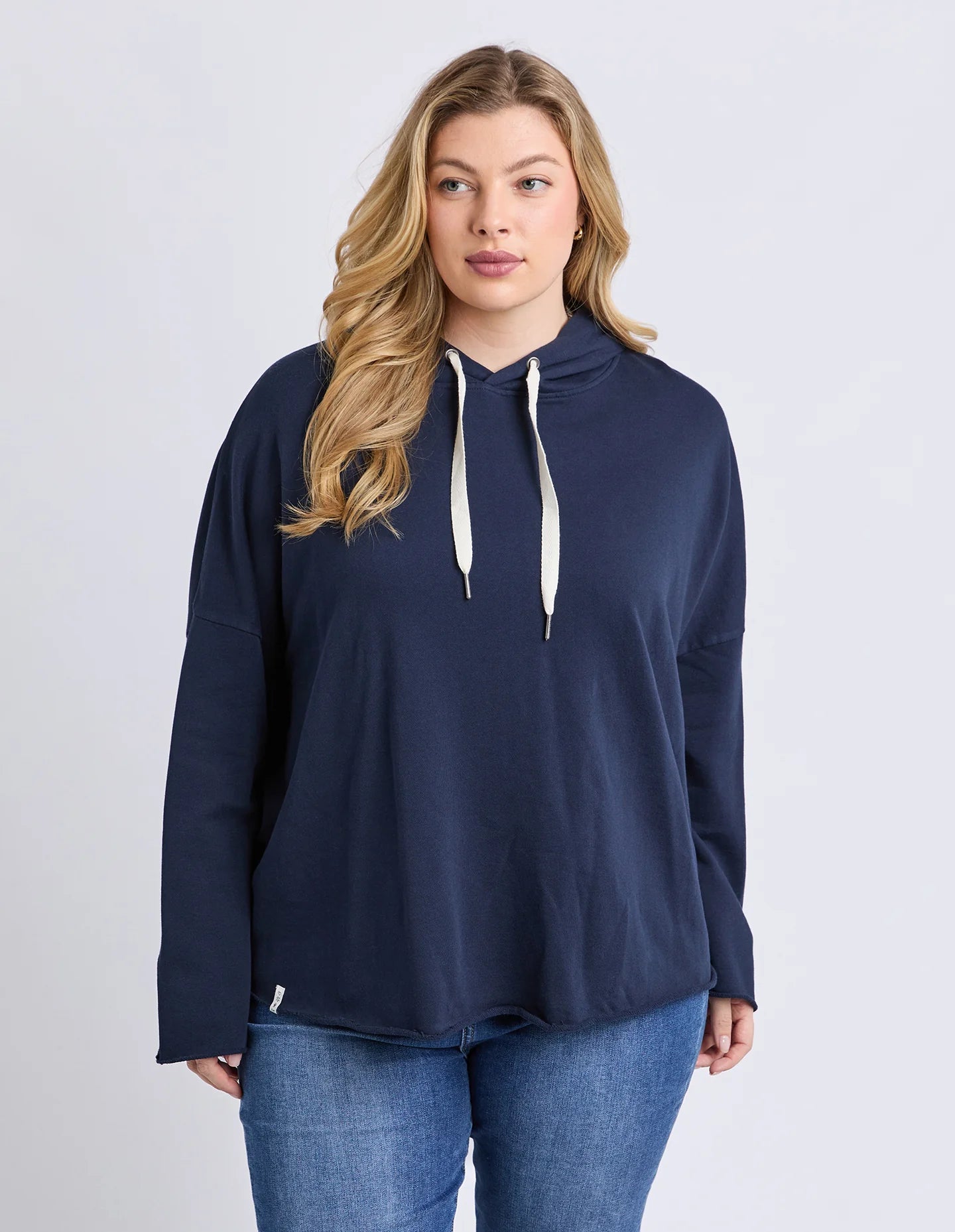 Model wearing Elm Gab Hoodie in Dark Sapphire — casual NZ style