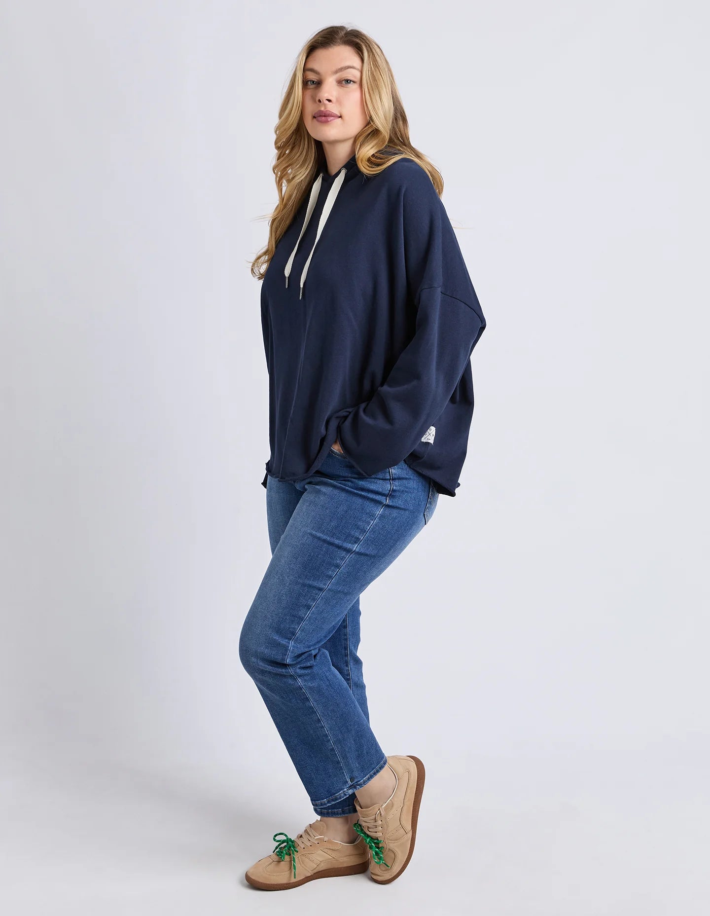 Side profile of Elm Gab Hoodie showing extended sleeve panel detail