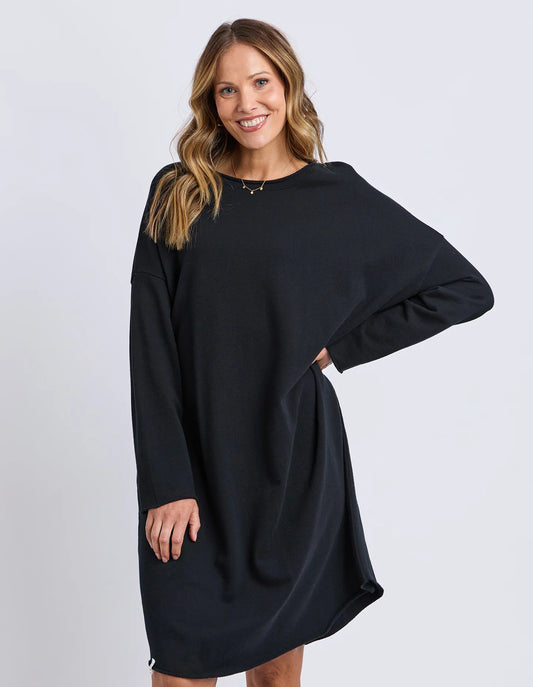 Elm Gab Long Sleeve Dress in Black — oversized long sleeve cotton fleece dress with raw hems, relaxed fit and knee‑length silhouette.