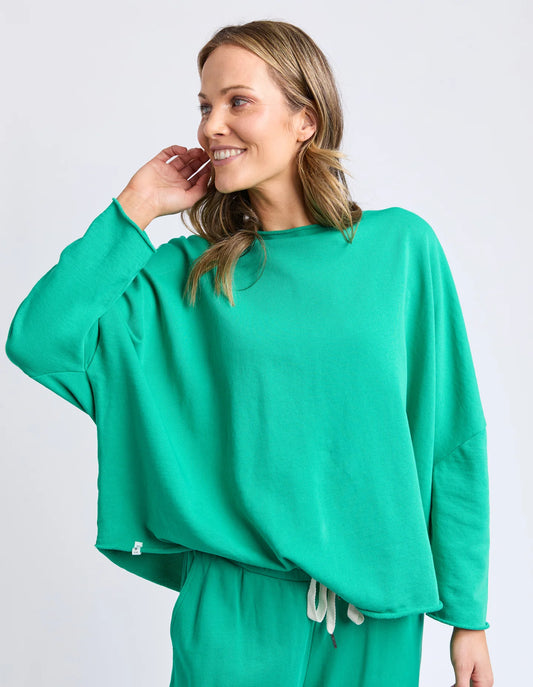 Elm Gab Long Sleeve Sweat in Turquoise — oversized cotton fleece sweatshirt with raw‑edge details and relaxed fit.