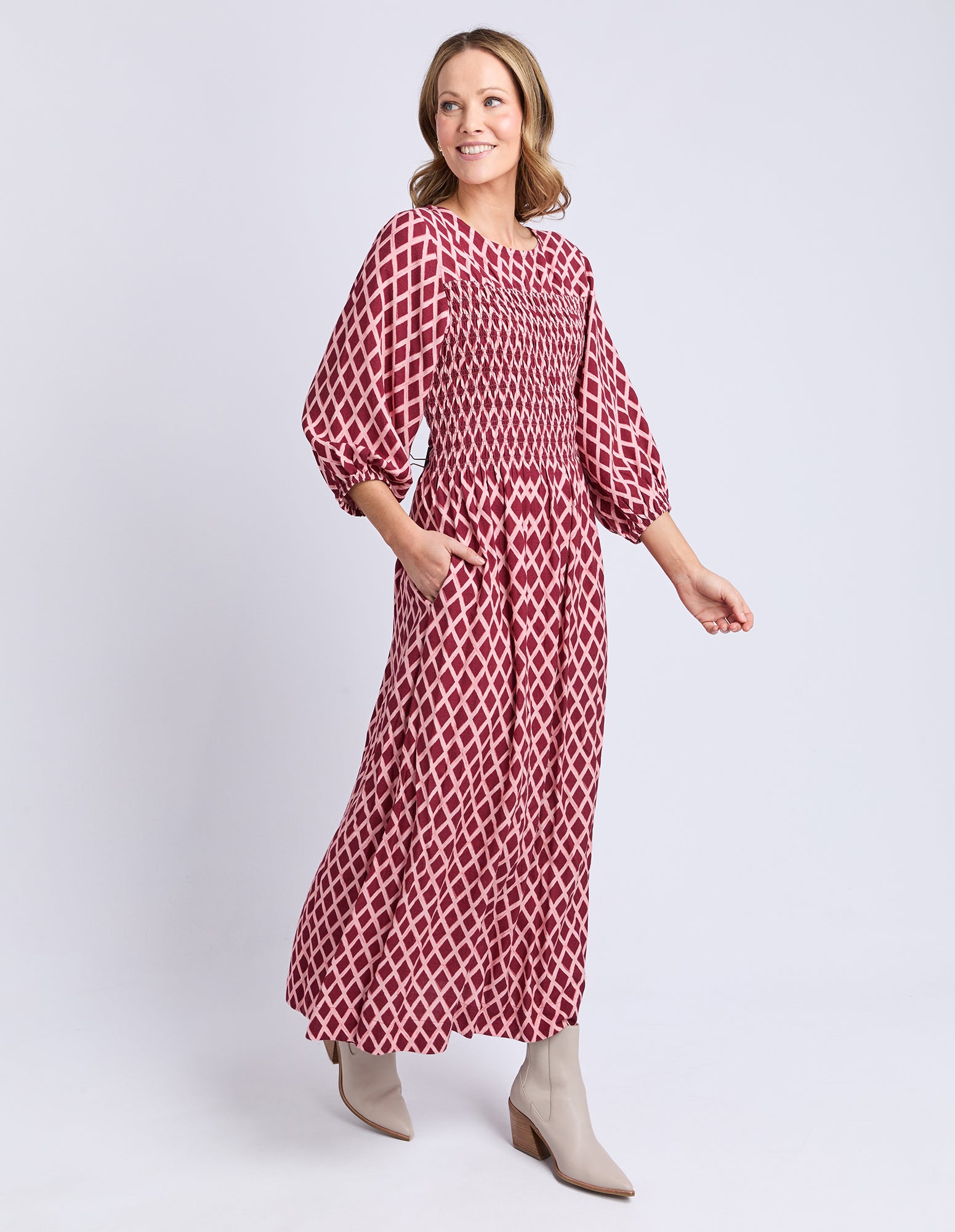 Side profile of Elm Kiruna Dress showing soft drape and elastic cuffs