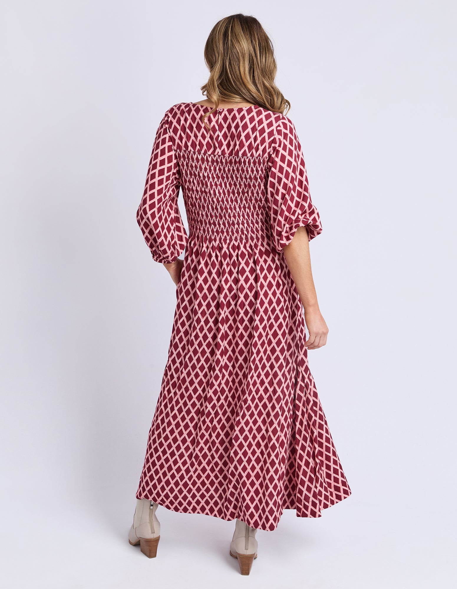 Back view of Elm Kiruna Dress in Diamond Print — relaxed skirt drape