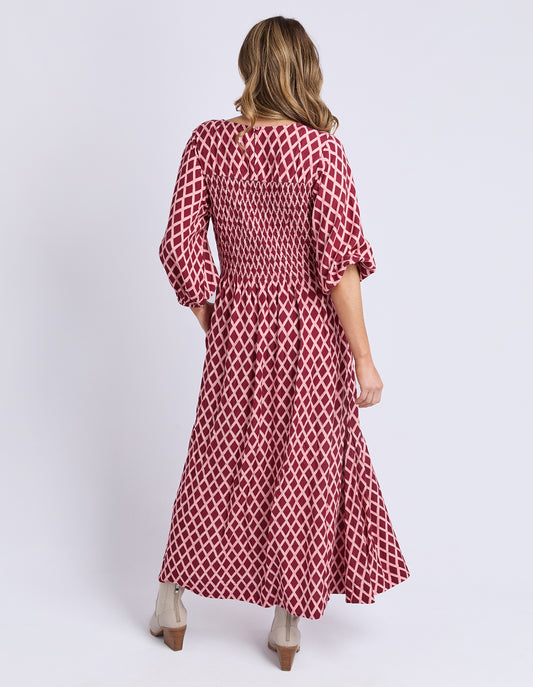 Back view of Elm Kiruna Dress in Diamond Print — relaxed skirt drape