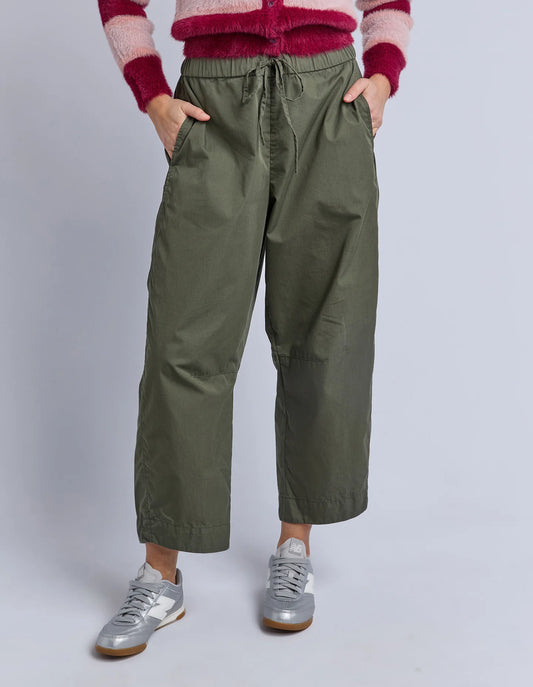 Front view of Elm Lund Barrel Leg Pant in Basil with ankle length cut