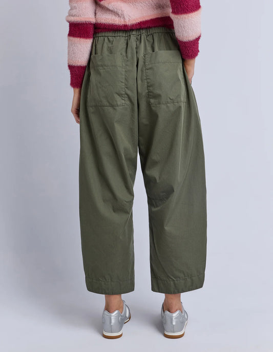 Back view of Elm Lund Barrel Leg Pant in Basil — relaxed silhouette