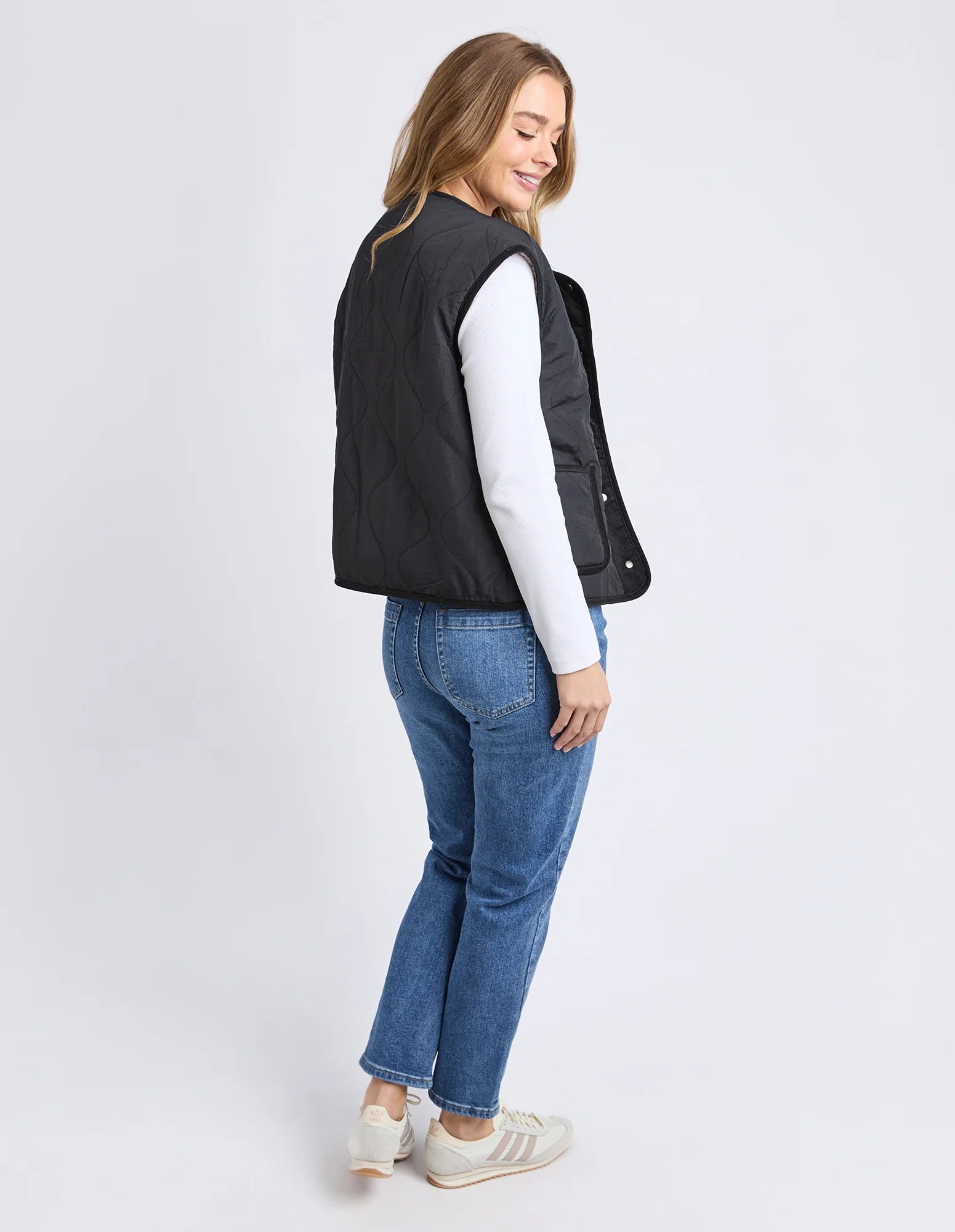Back view of the Alberta Vest highlighting lightweight quilted design.

