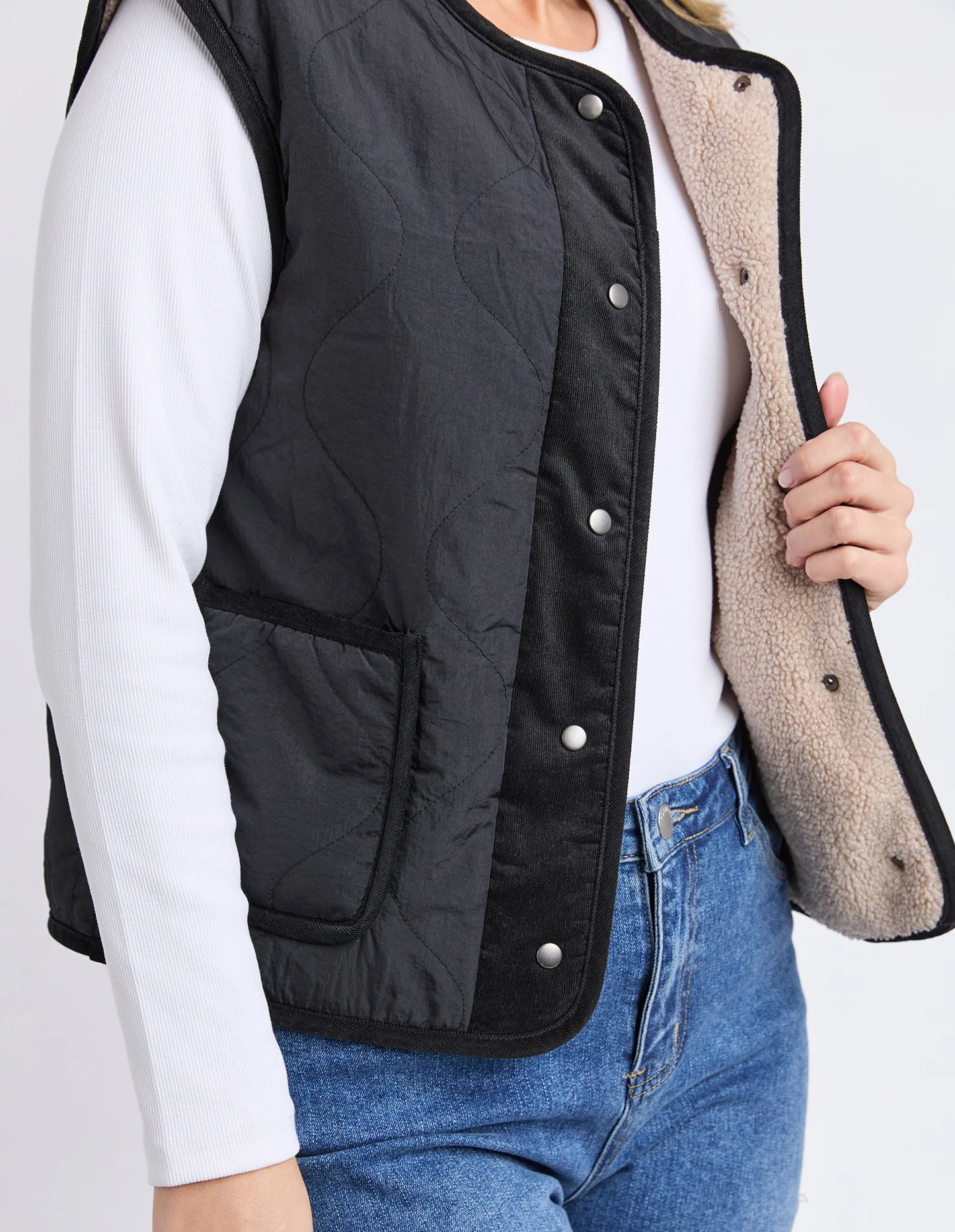 Close‑up of sherpa lining and quilted texture on the Foxwood Alberta Vest.

