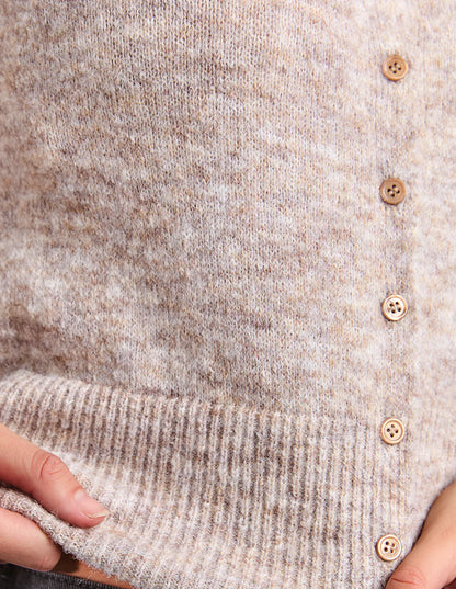 Close‑up of Oatmeal knit texture and ribbed detailing.