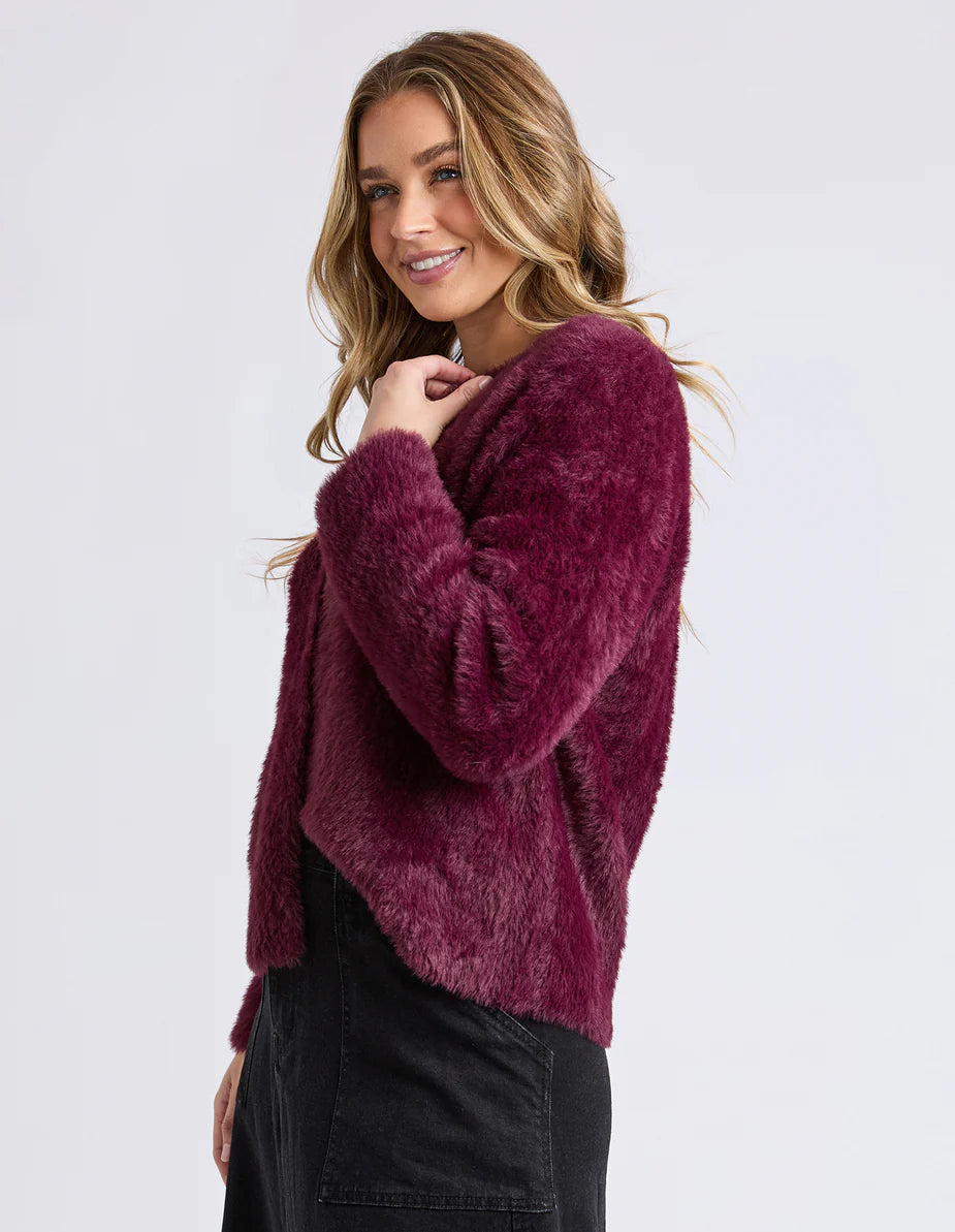 Side angle of the Foxwood Kenny Cardi showing round neckline and cosy knit texture.

