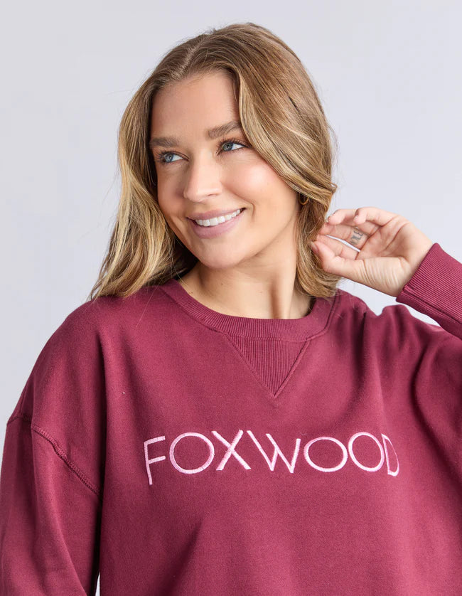 Close‑up of metallic Foxwood chest embroidery on the Simplified Crew in Port

