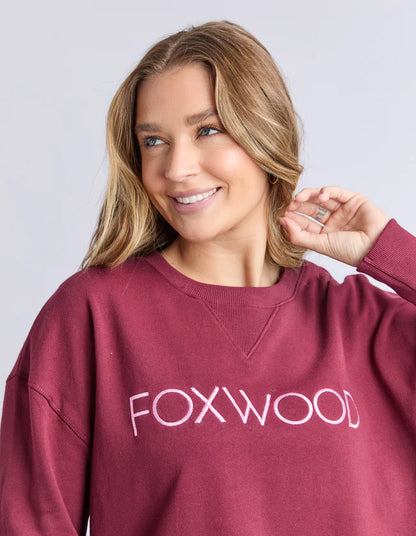 Close‑up of metallic Foxwood chest embroidery on the Simplified Crew in Port

