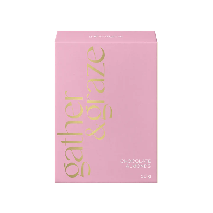 Pink packaging of Gather & Graze with gold text on a white background