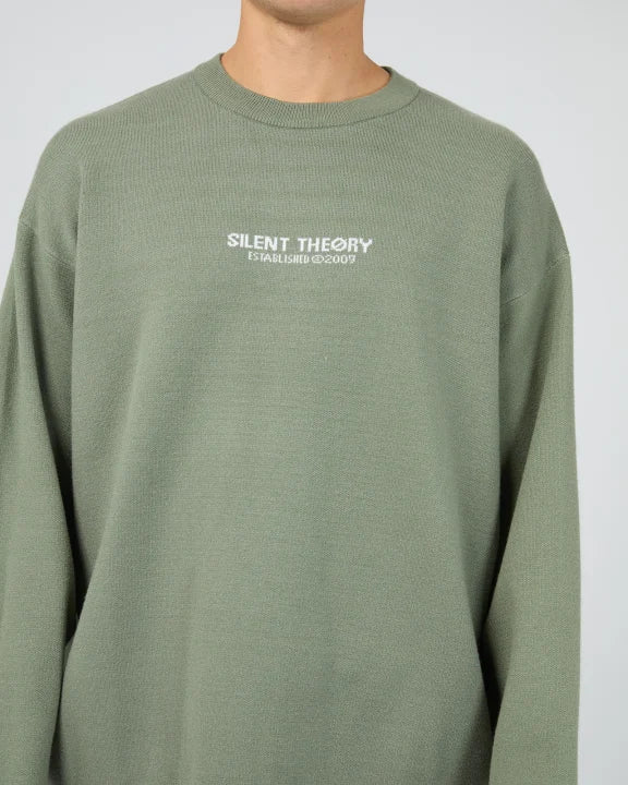 Close‑up of Silent Theory logo on men’s Eucalyptus knit

