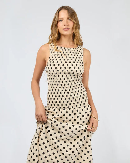 Polka‑dot maxi dress styled with knit and boots — Salt & Honey