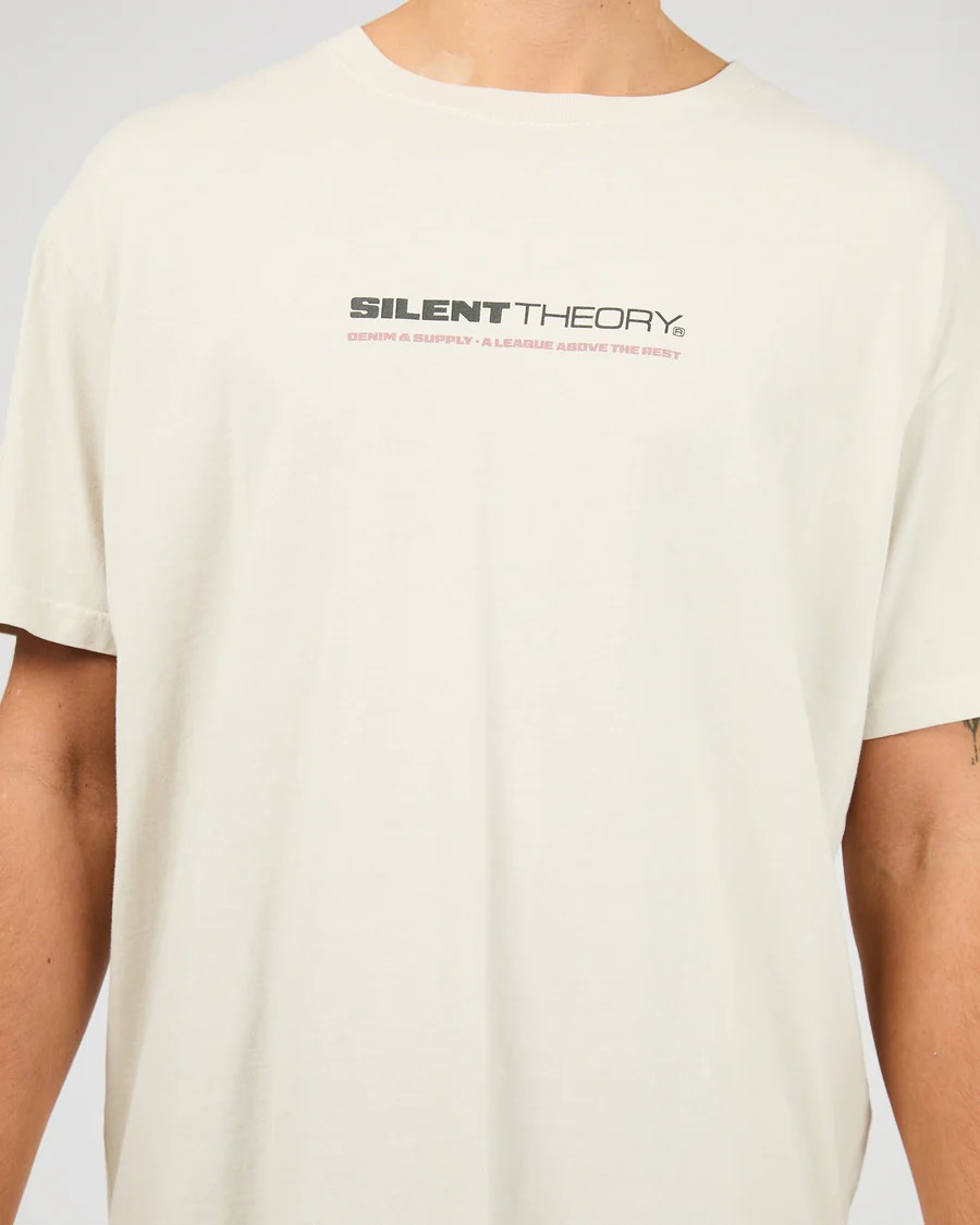 Close‑up of Silent Theory branding on Bone Tuscan Scoop Tee