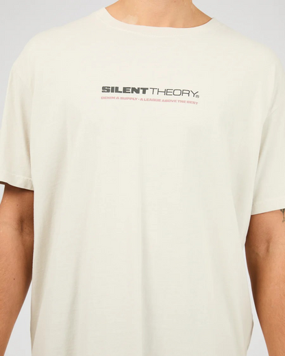 Close‑up of Silent Theory branding on Bone Tuscan Scoop Tee